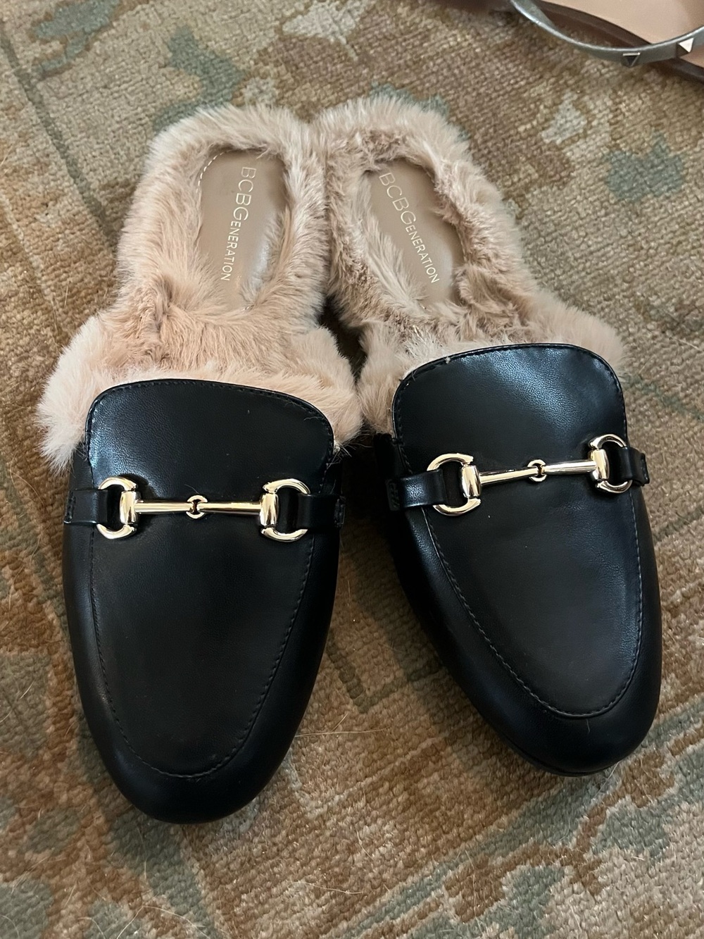 BCBGeneration Black Leather Mules with Gold Horsebit and Cream Fur
